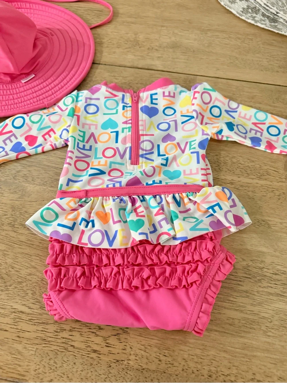 Rufflebutts rash guard and hat. 3/6